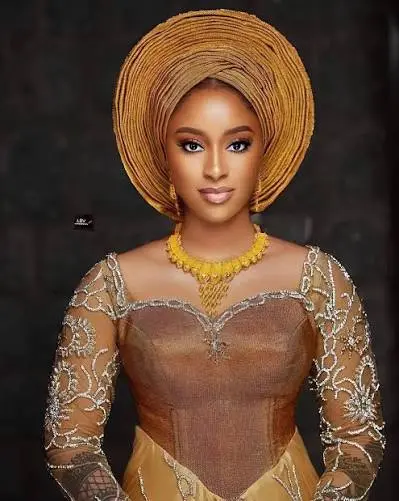 Gold gele with a gold statement necklace